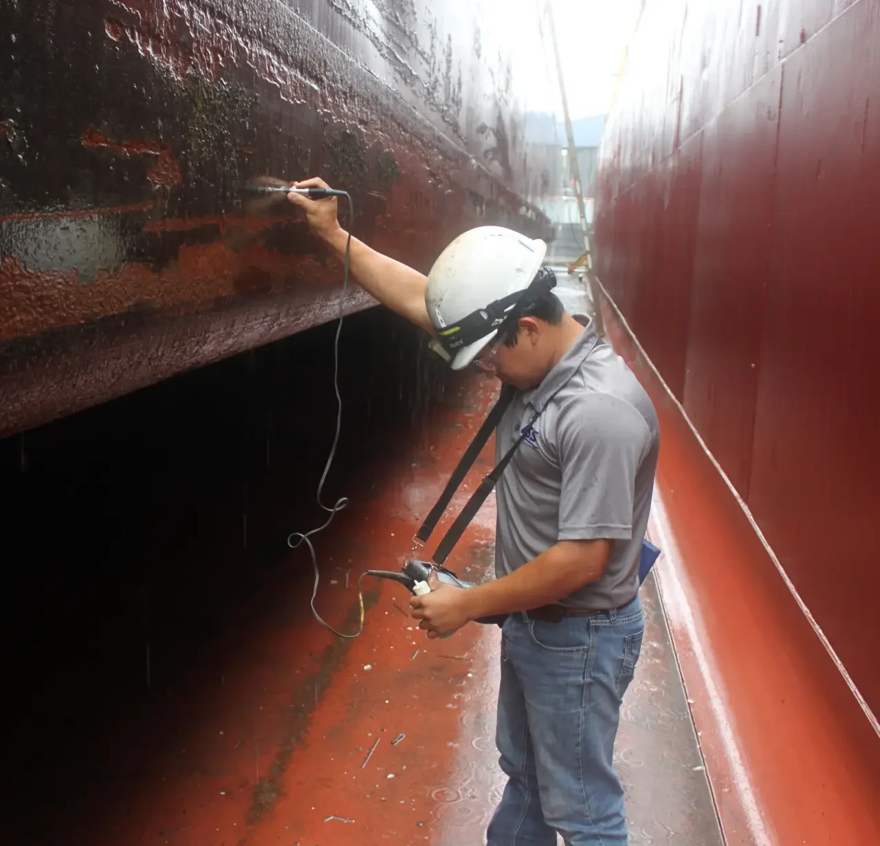 Ultrasound inspection of marine coating thickness on barge hull